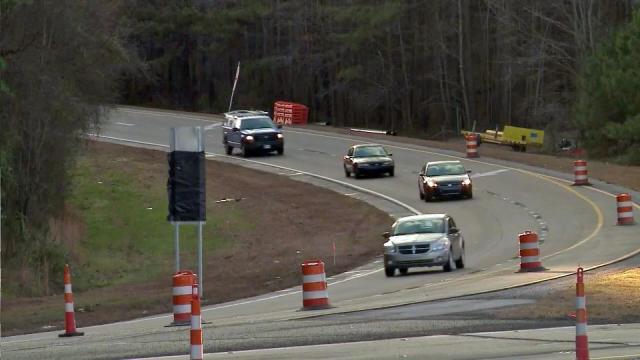 Cars driving through road construction in North Carolina.